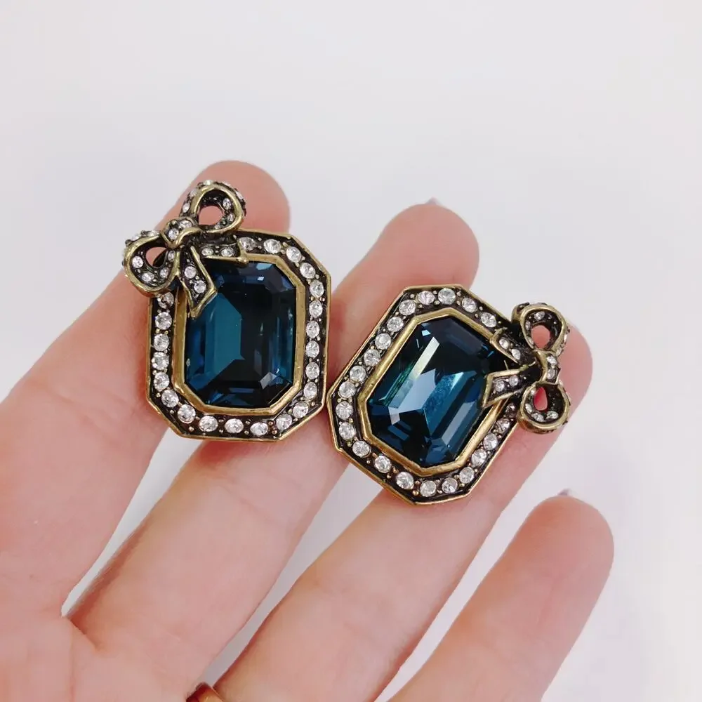 Vintage Signed Heidi Daus Blue Glass Bow Clip On Earrings Rhinestone Collectible